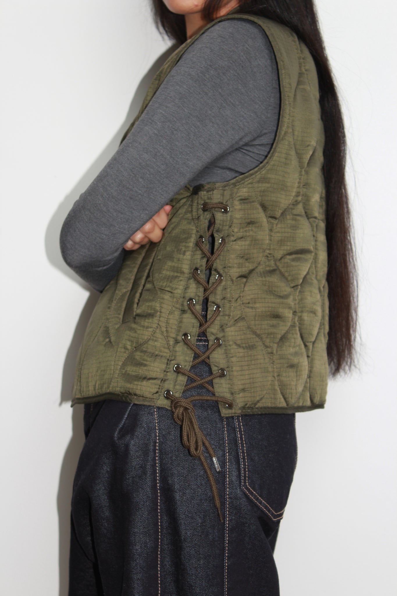 Grommet lace up quilted vest